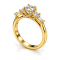 Round moissanite three-stone engagement ring, angled view