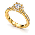 Round moissanite halo pavé engagement ring, angled view