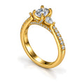 Oval moissanite three-stone engagement ring with pear side stones and pavé band, angled view